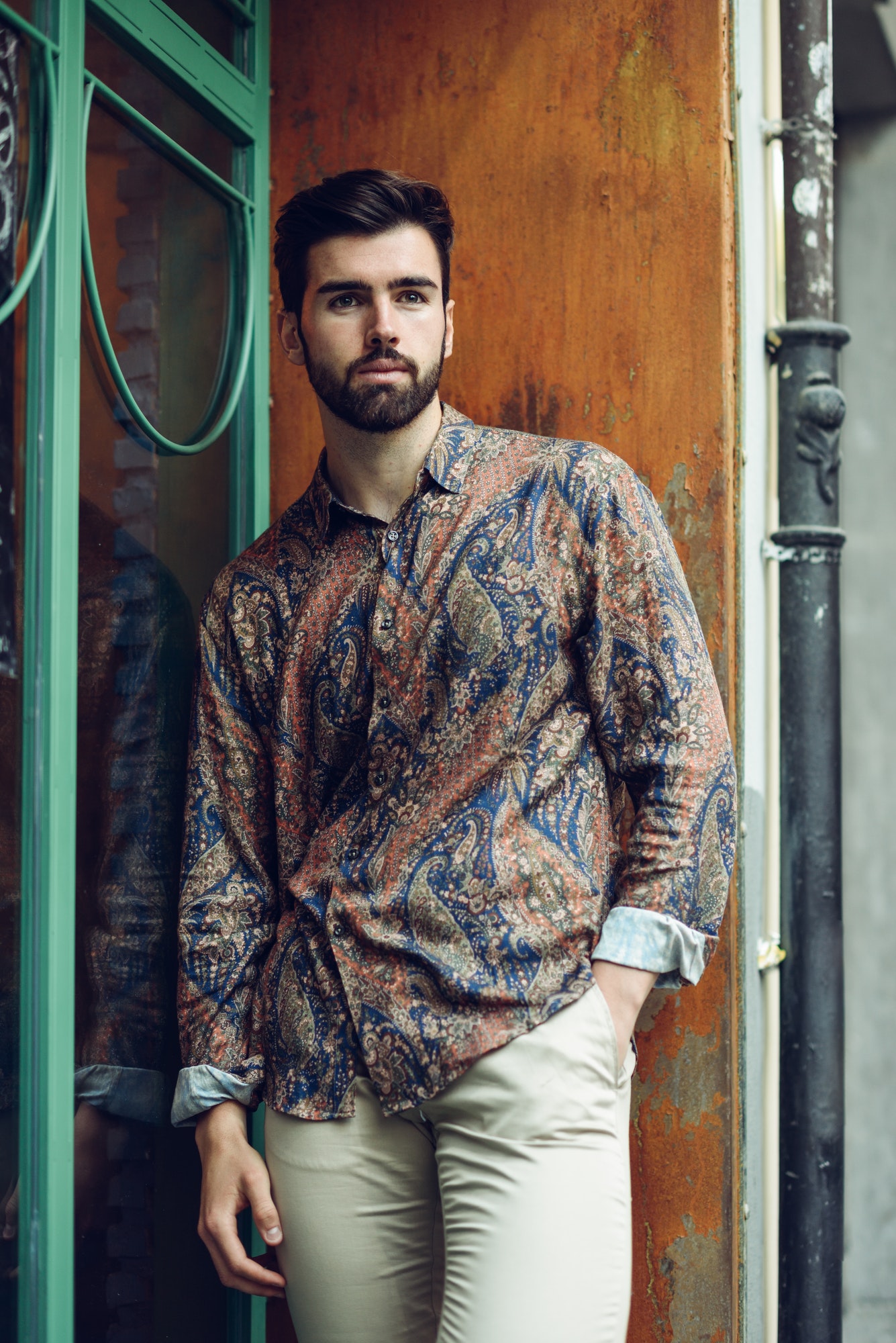 young-bearded-man-model-of-fashion-wearing-shirt-in-urban-back.jpg
